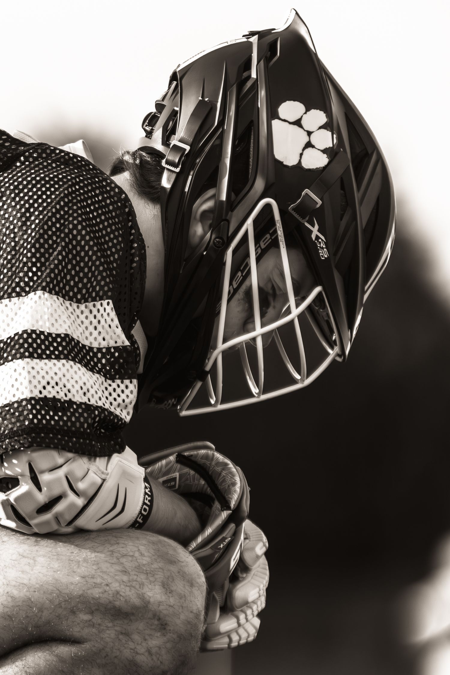 Close-up black and white artistic shot of baseball gloves and equipment.
