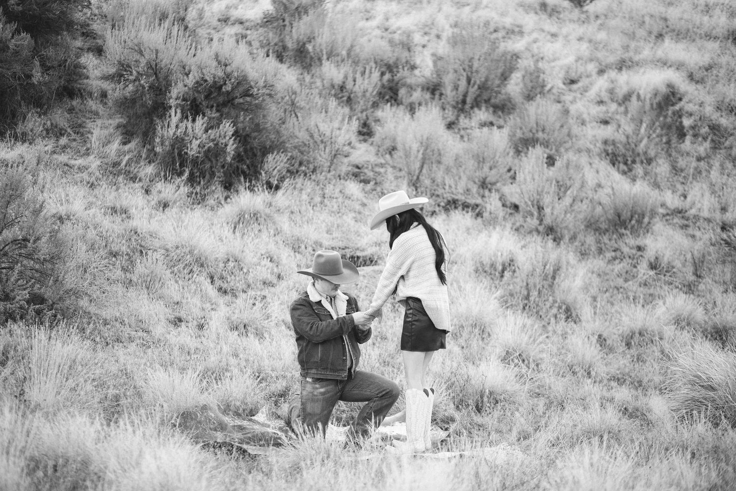 This Black & White photo show a surprise engagement photo shoot in the Boise Idaho foothills in the western inspired photo