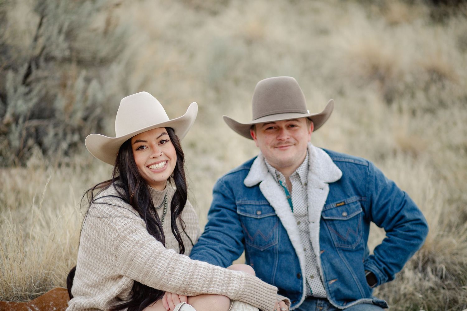 A couple enjoy each others company in this engagement photoshoot as they smile with each other in this crisp fall air in Eagle Idaho
