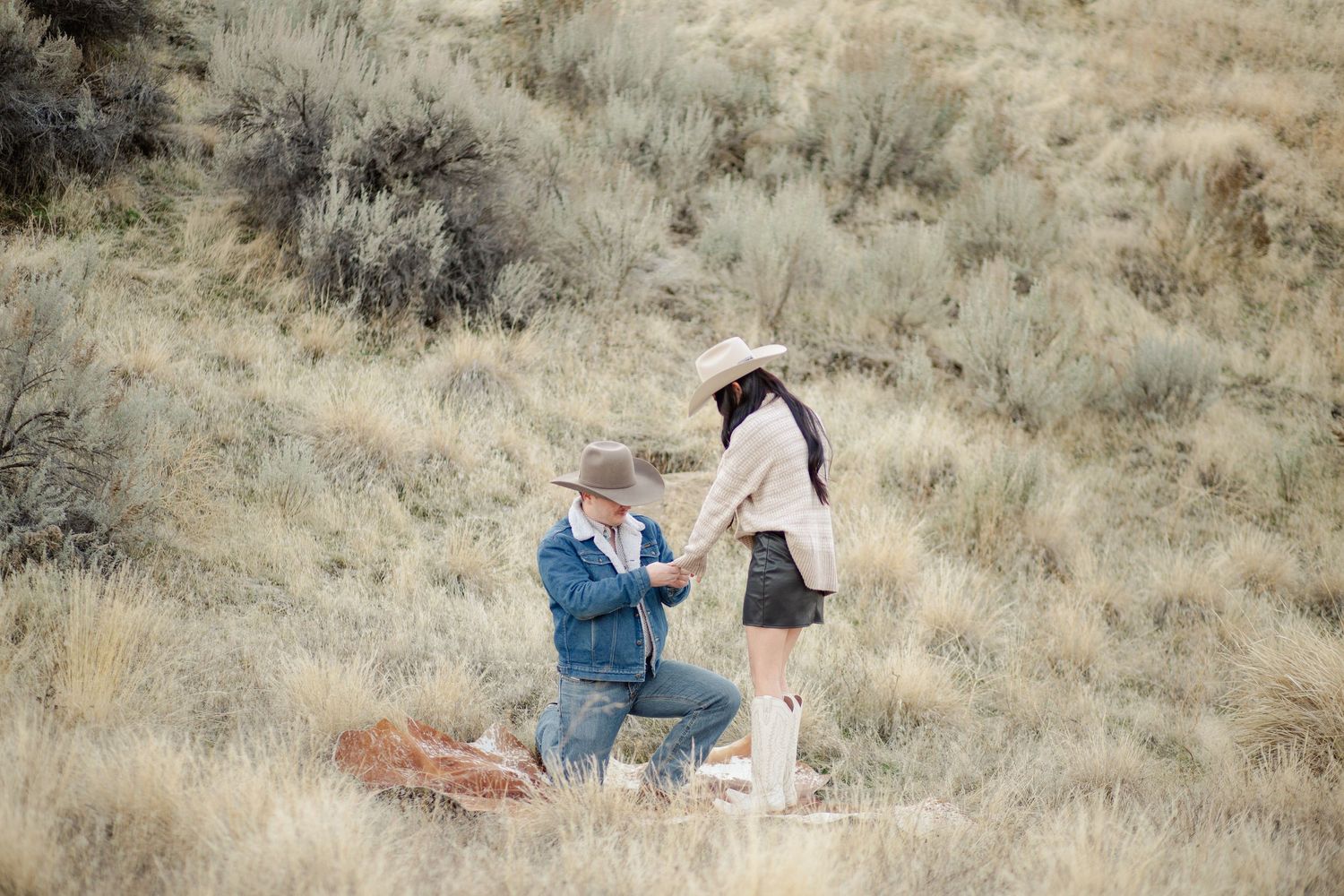 This photo showcases a surprise engagement photoshoot located in the eagle Idaho foothills taken by stoked media photography