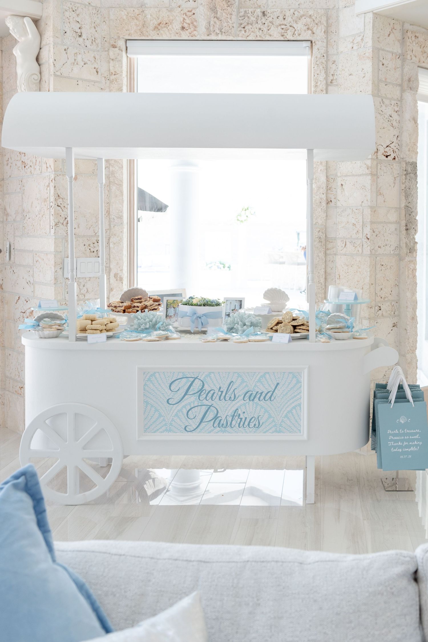 Custom sweet cart at a bridal shower by the sea.