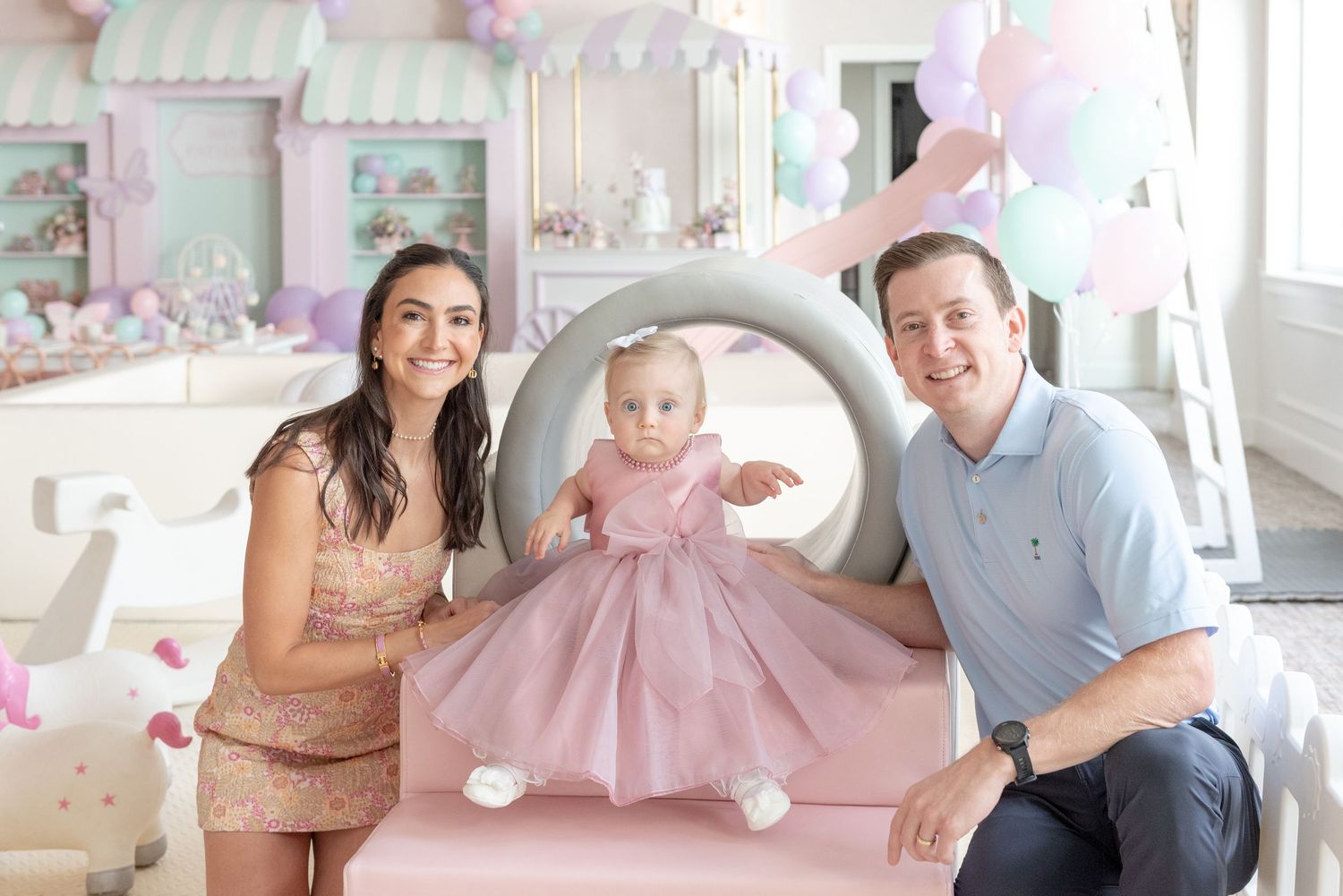 A collage of family photos showing parents and baby in pink dress against a bright interior setting.