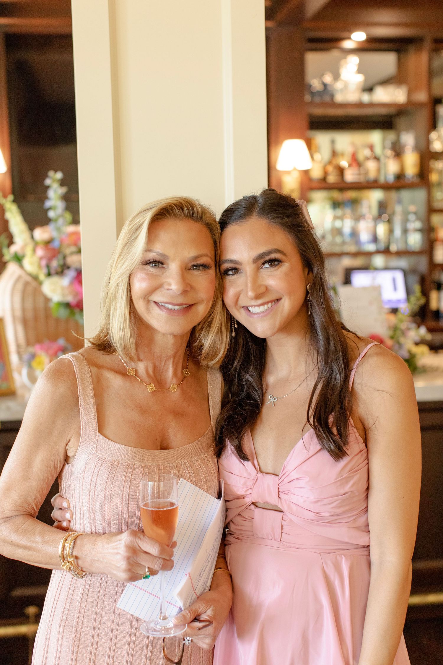 Mommy and daughter pose after a speech at a baby shower.