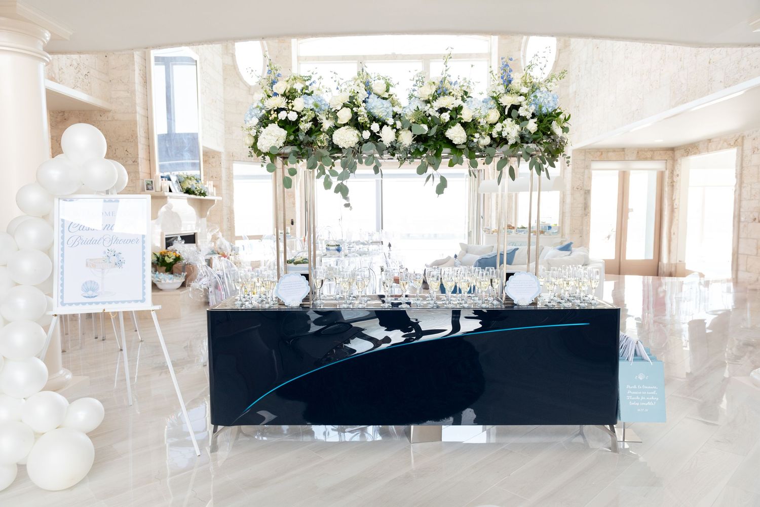 The entrance display at a bridal shower by the sea.