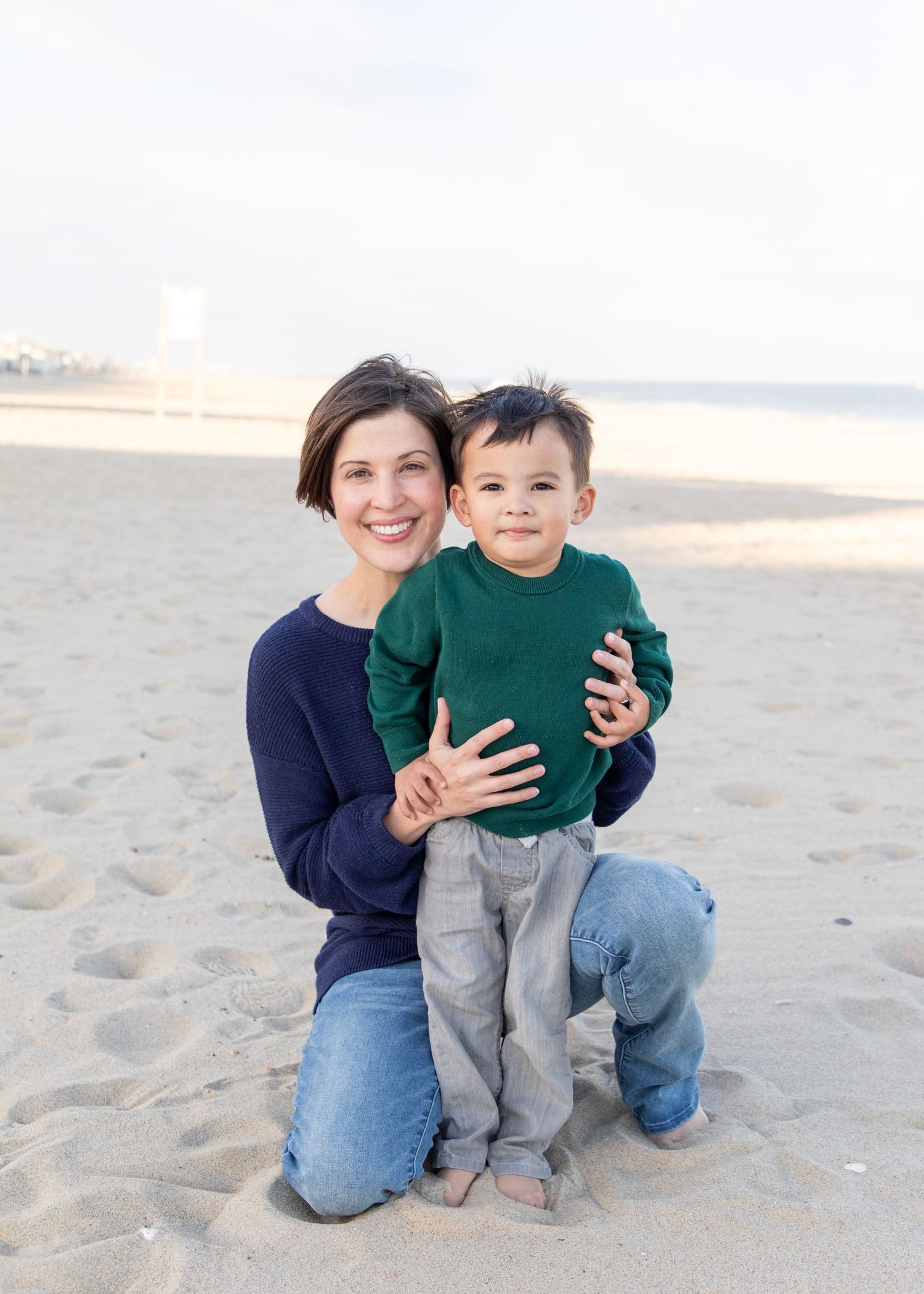 Mommy and son during a family photo session at the beach.