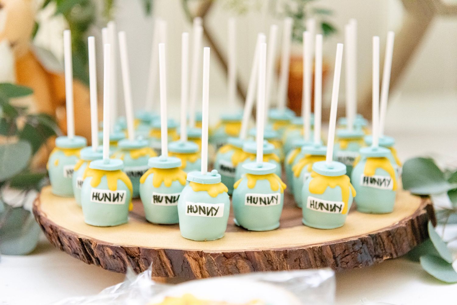 Cake pops from our ONE Hundred Acre Wood design.