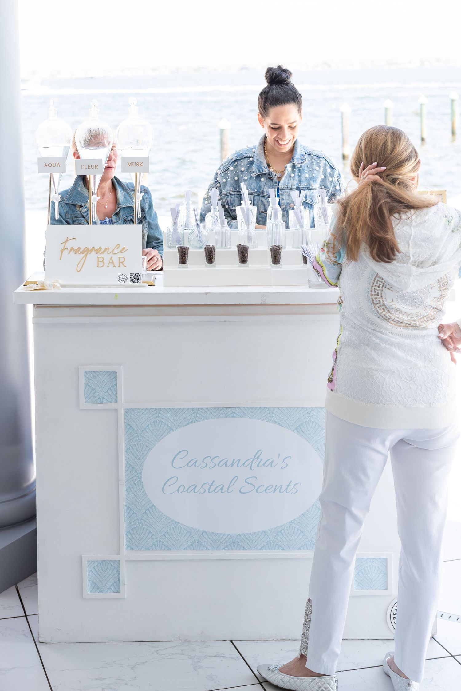 Custom fragrance bar at a bridal shower by the sea.