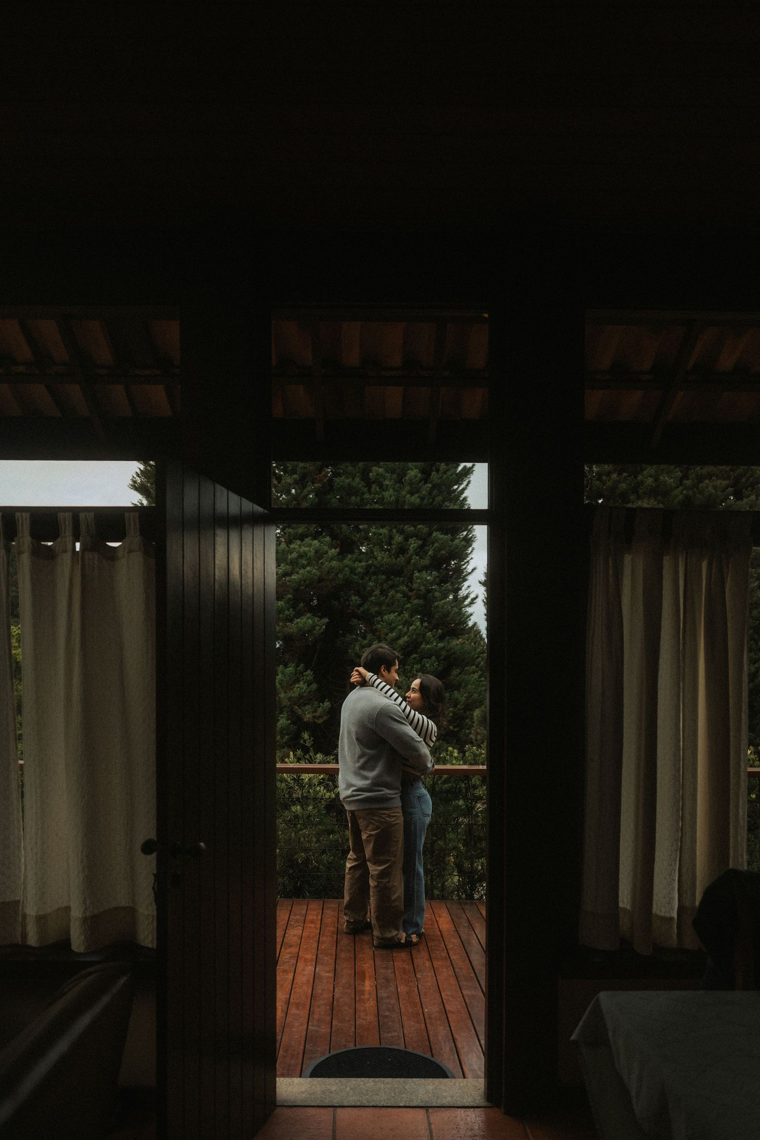 A sequence of photos showing a couple dancing on a dimly lit porch at night.