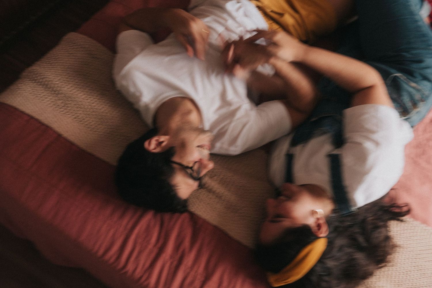 Series of photos showing someone sleeping comfortably in bed at different moments, shot from above.