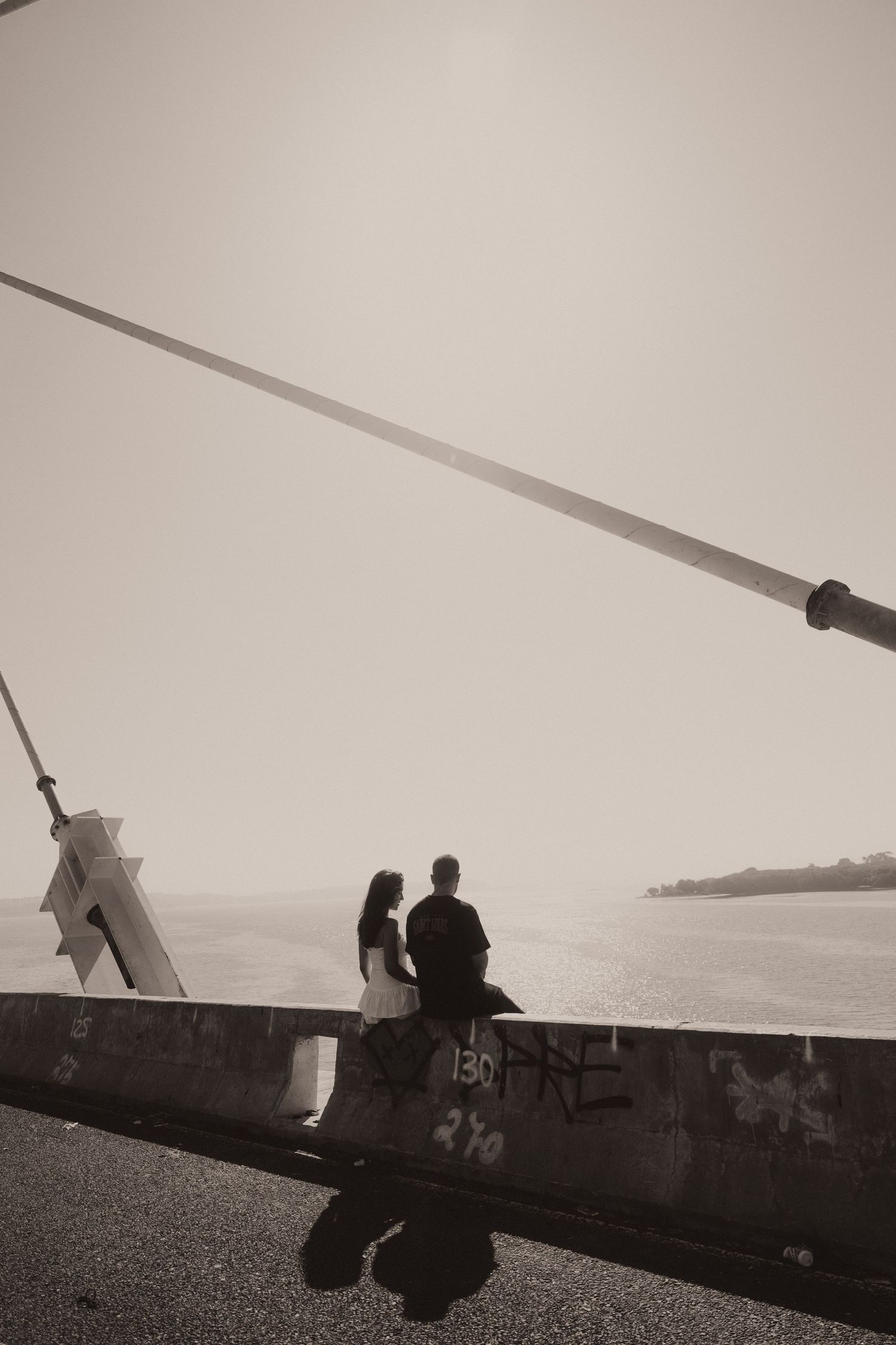 A sequence of black and white photos showing silhouettes of an airplane and people against a bright sky background.