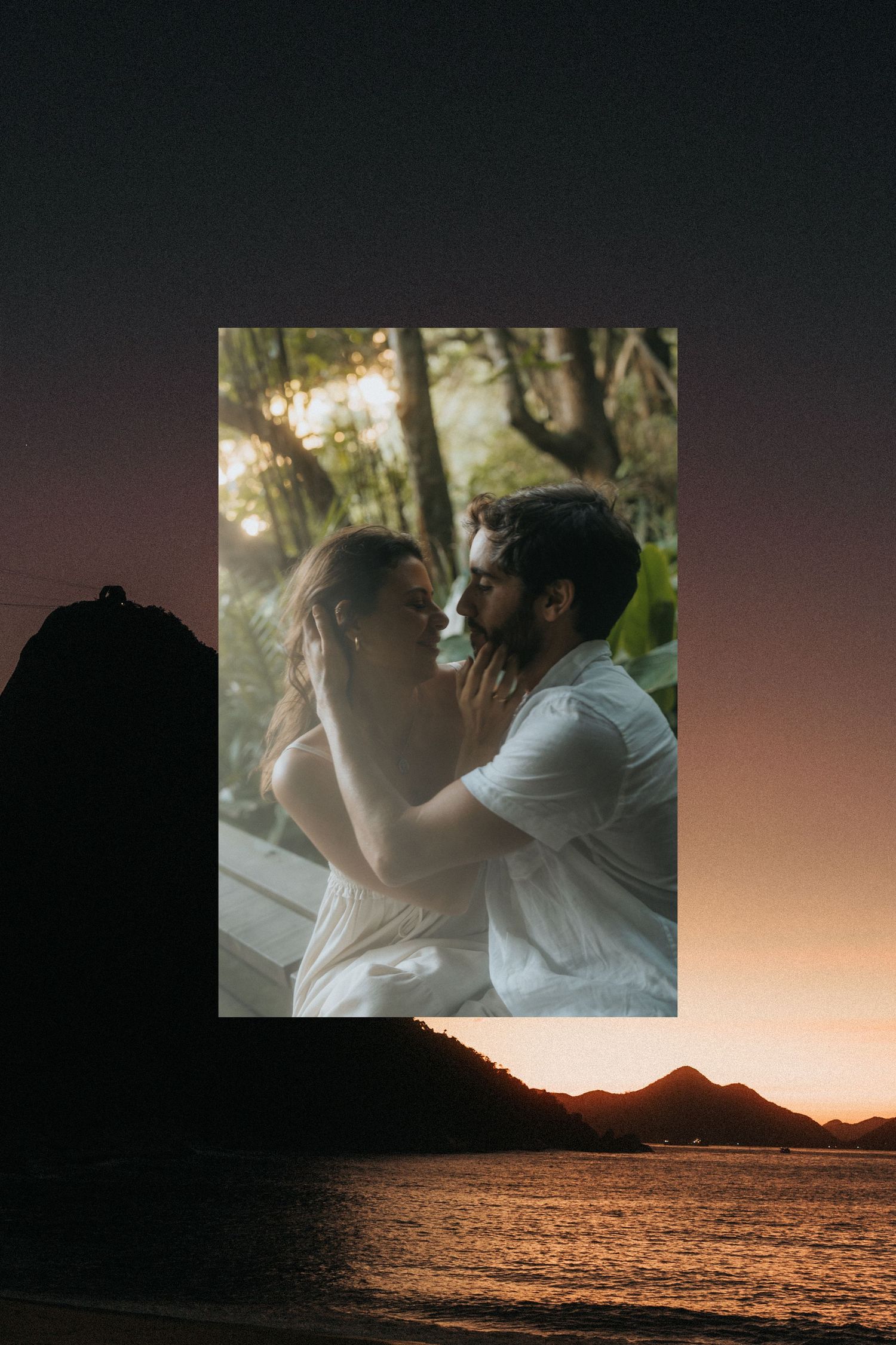 A serene golden sunset over a mountain range and calm ocean water with soft orange and purple hues in the sky.