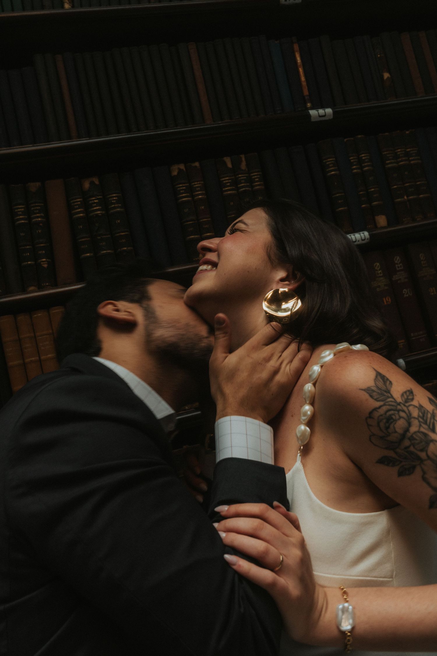 A romantic sequence of wedding photos showing intimate moments between newlyweds in dark lighting.
