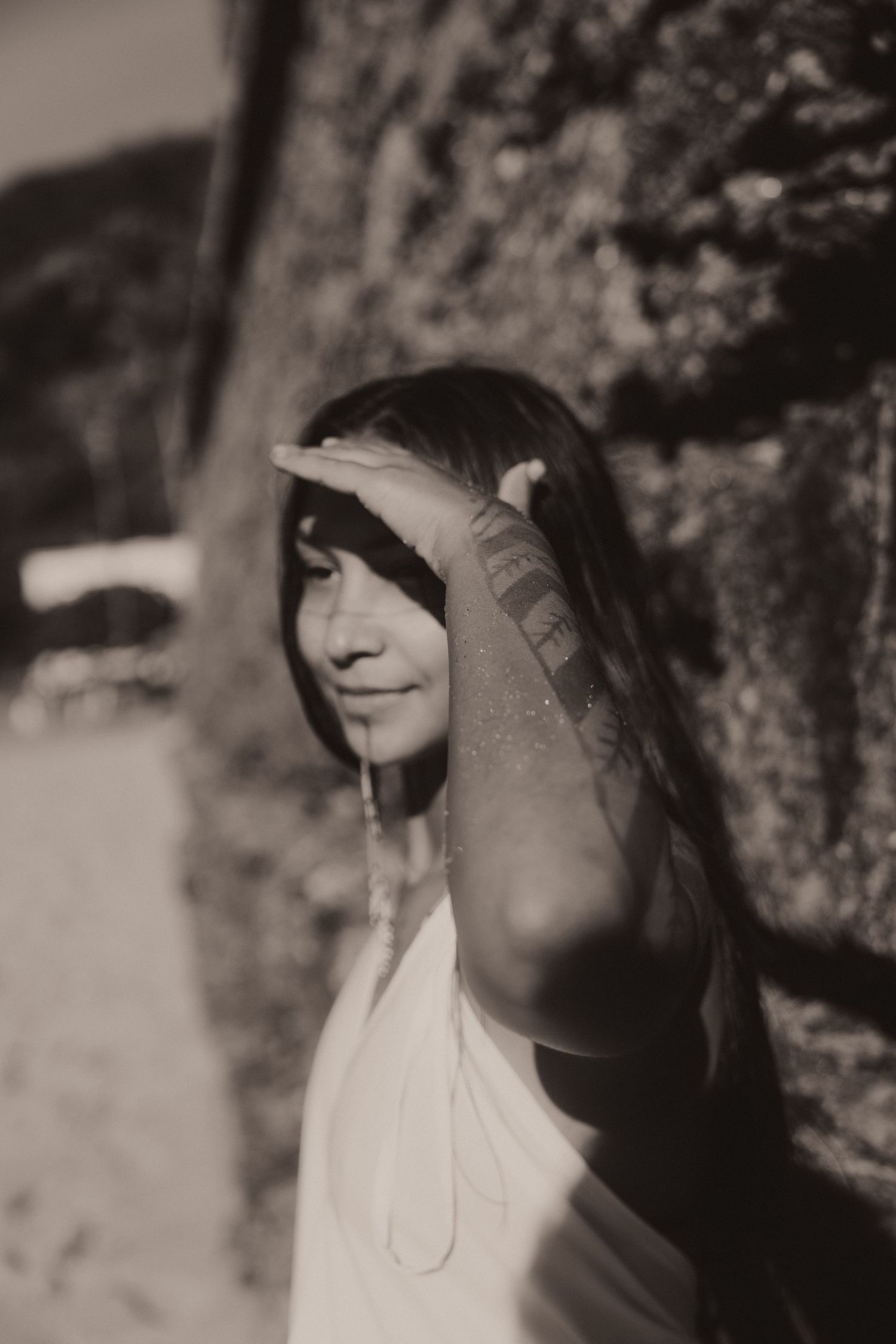 A black and white artistic portrait showing a silhouette in shadow with dramatic lighting.