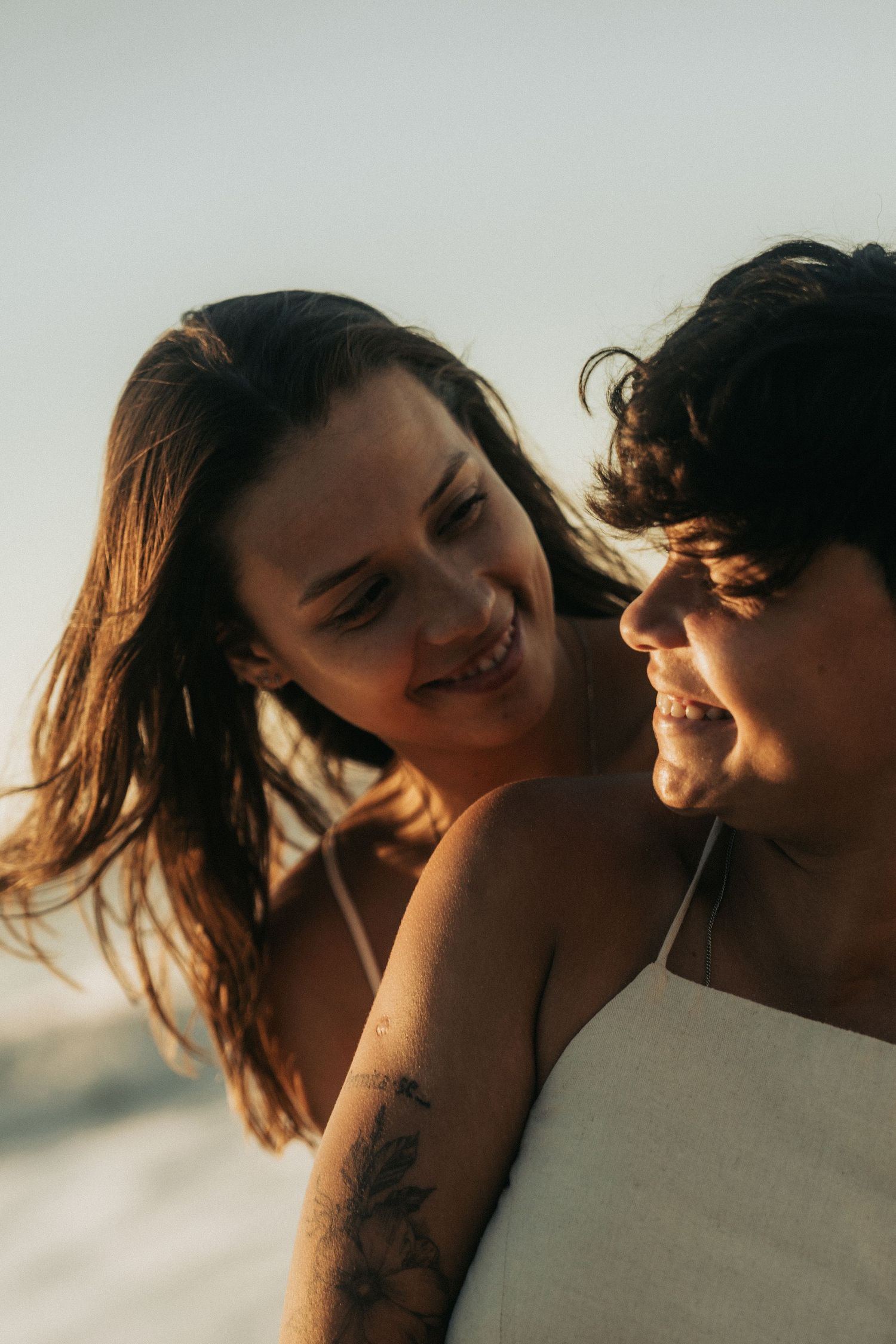 A romantic couple shares tender moments in a series of intimate sunset portraits.