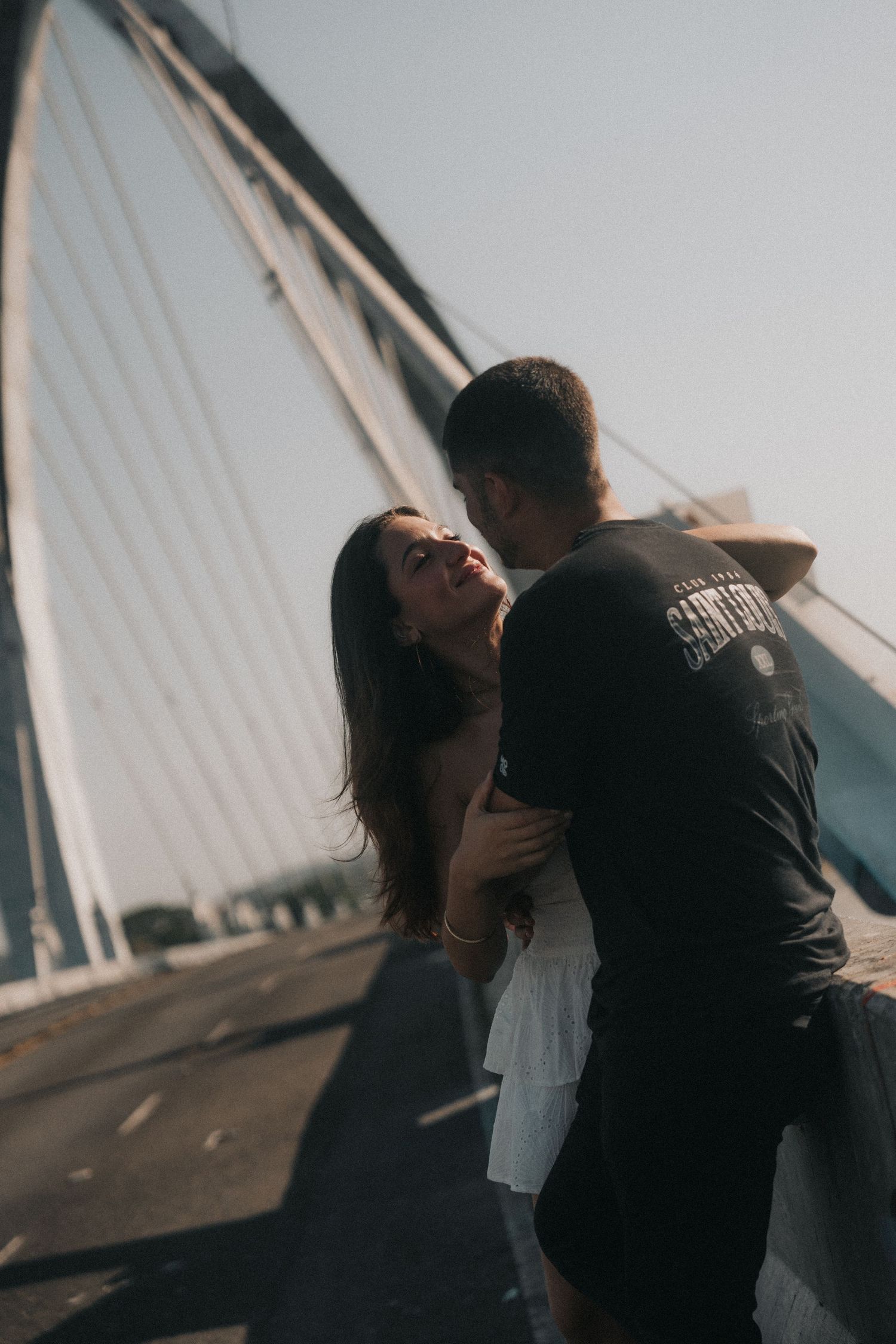 Romantic silhouette of couple embracing on rooftop at sunset shows progression of intimate moments in multiple frames.
