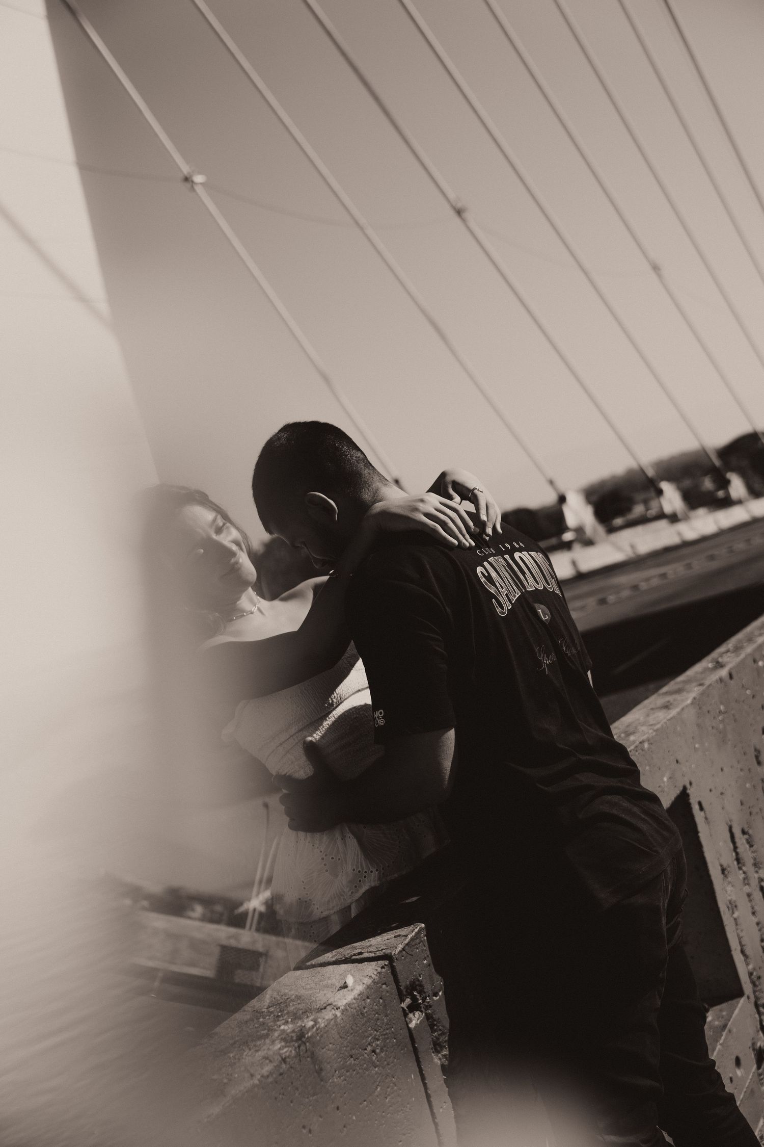 Black and white photo series showing a dark silhouette figure lying in an abstract motion blur effect.