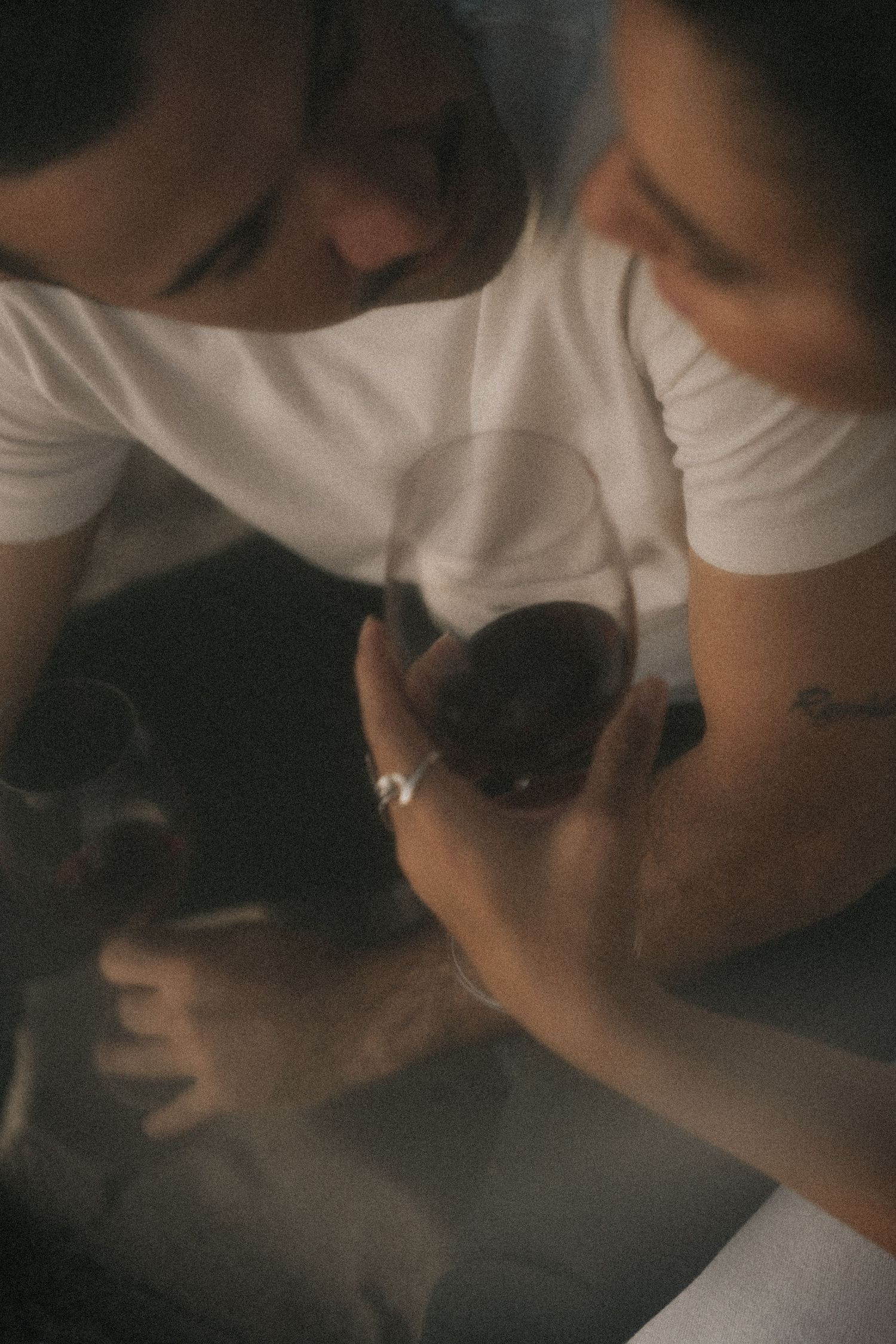 A series of dark, moody close-up portraits with artistic blurring and dramatic shadows.