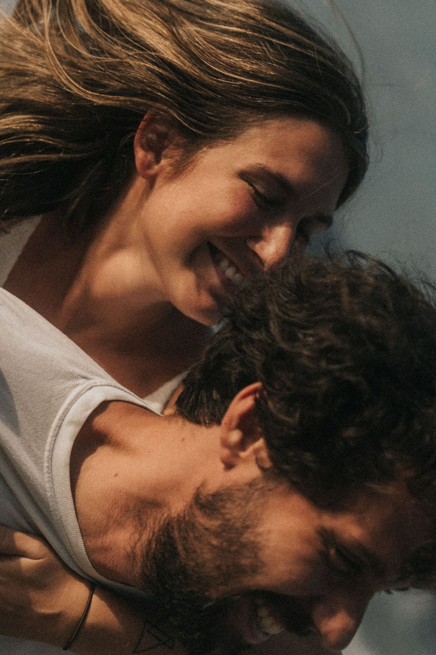 Close-up black and white photo series showing an intimate romantic moment between two people.