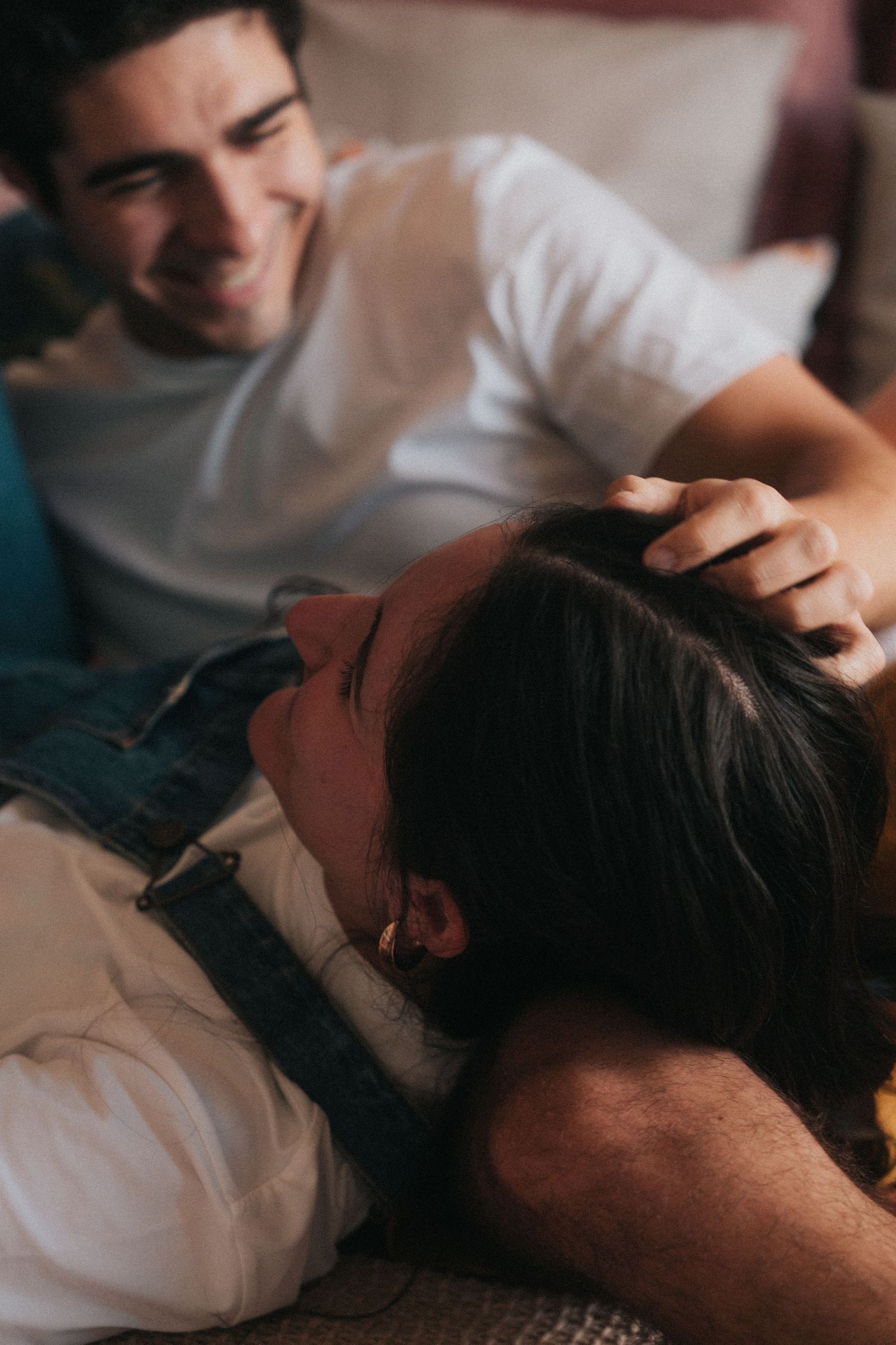 Close-up shots of a therapeutic massage session showing hands working on upper back area.