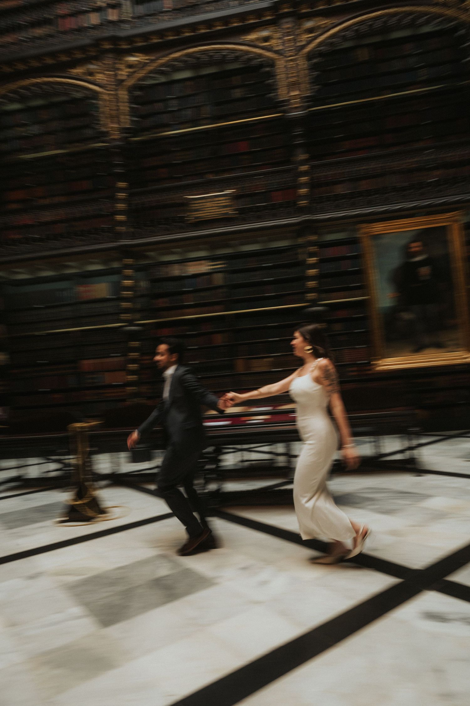 A series of artistic motion blur photos showing a couple dancing together on a white floor against a dark wall.