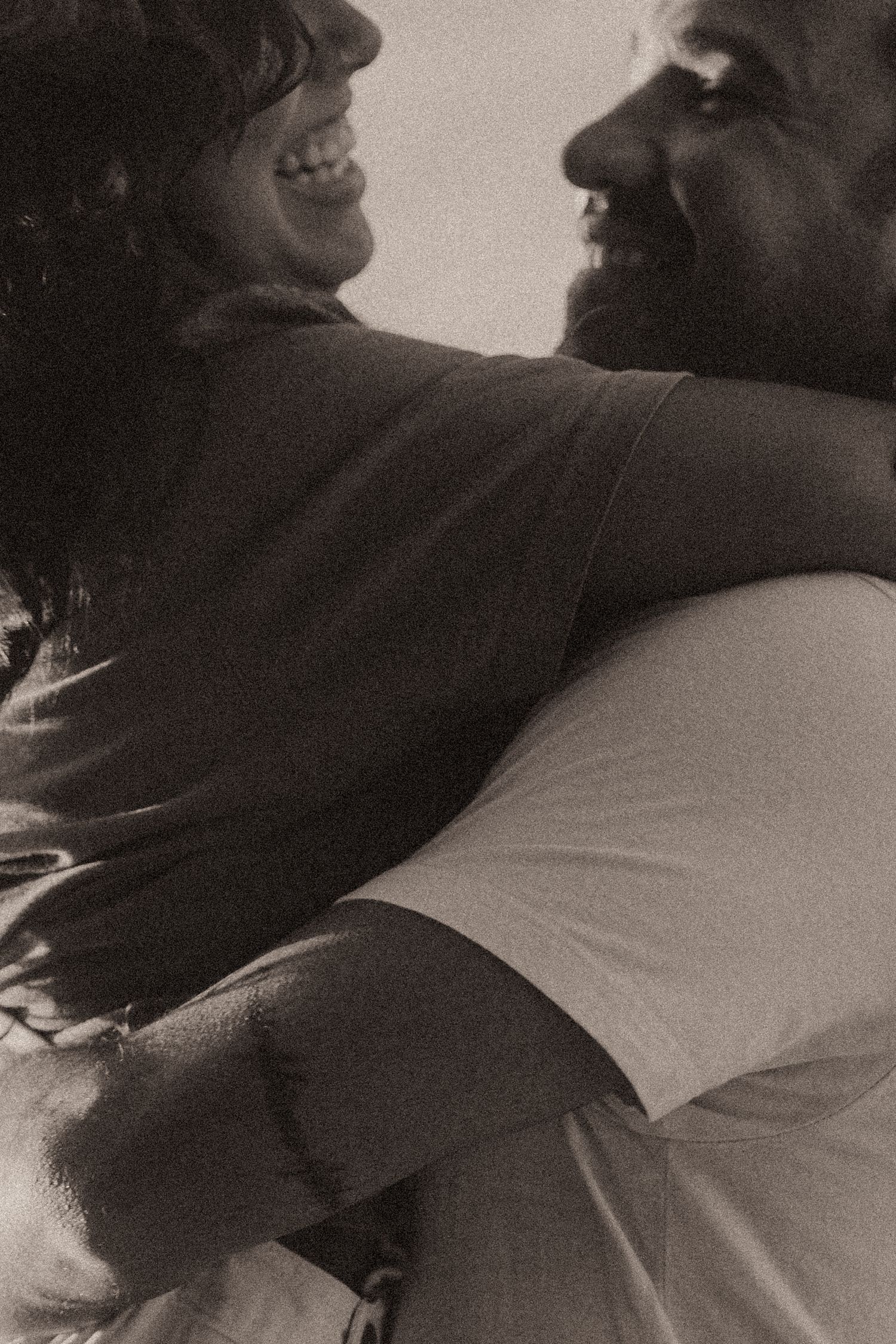A black and white artistic photo series showing intimate embraces and tender moments between sleeping people.