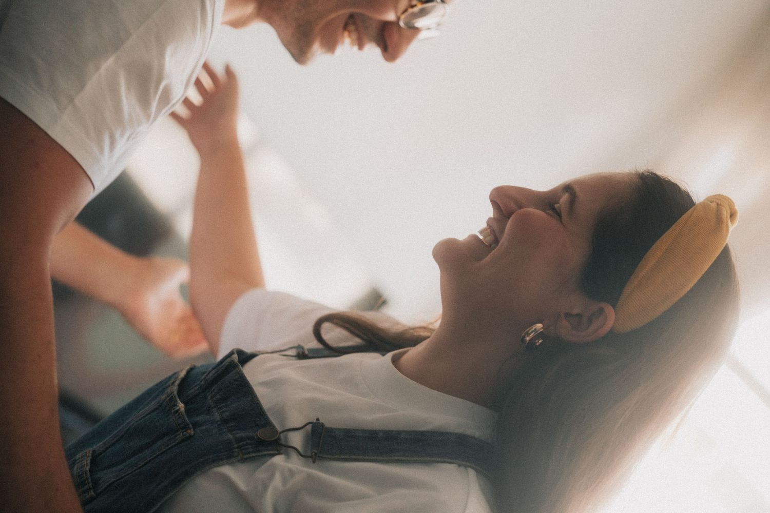 A collection of intimate close-up photos showing tender moments between couples in soft natural lighting.
