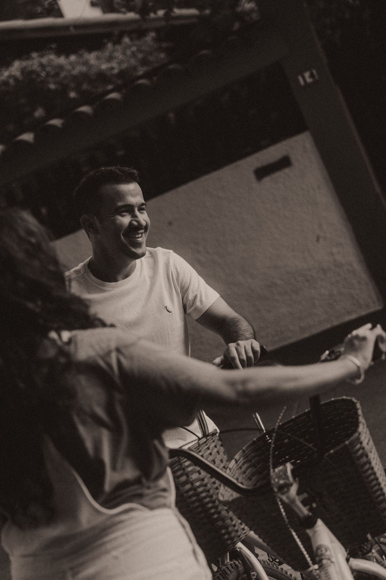 A series of black and white photos showing someone joyfully playing drums or percussion instruments.