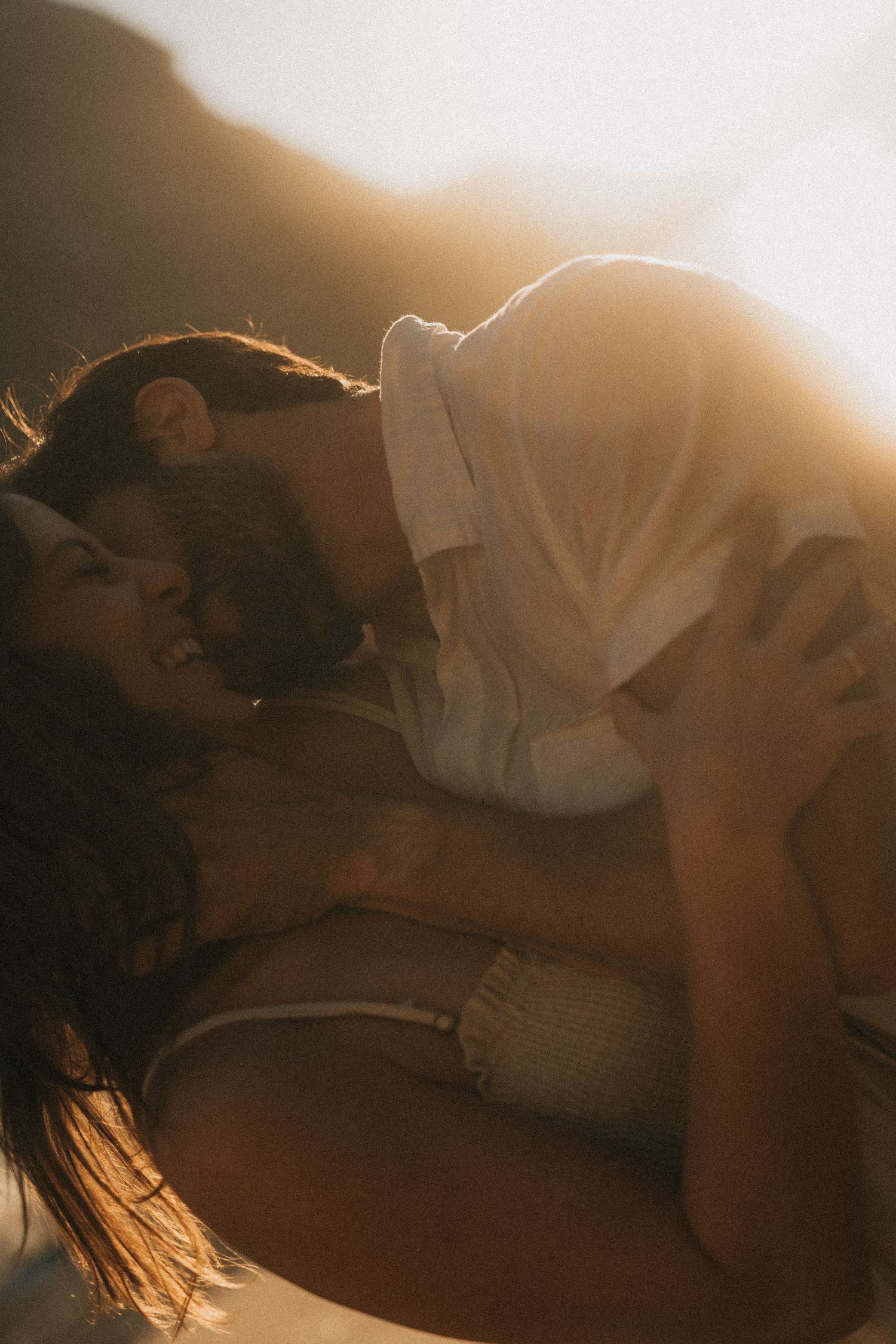 Multiple connected images show an intimate romantic scene silhouetted against golden sunlit backdrop.