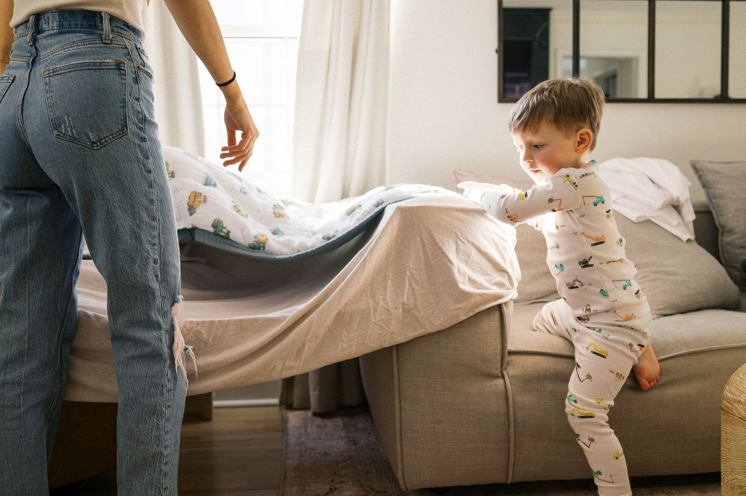 A series of lifestyle photos showing family moments on a cozy gray couch.