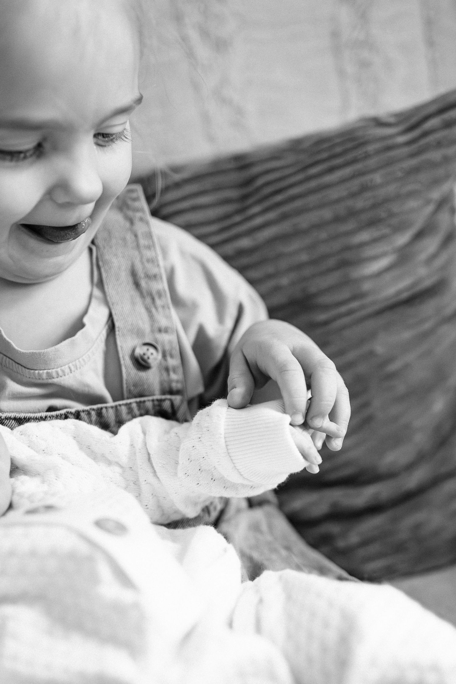 Close-up black and white photographs showing tender family moments.