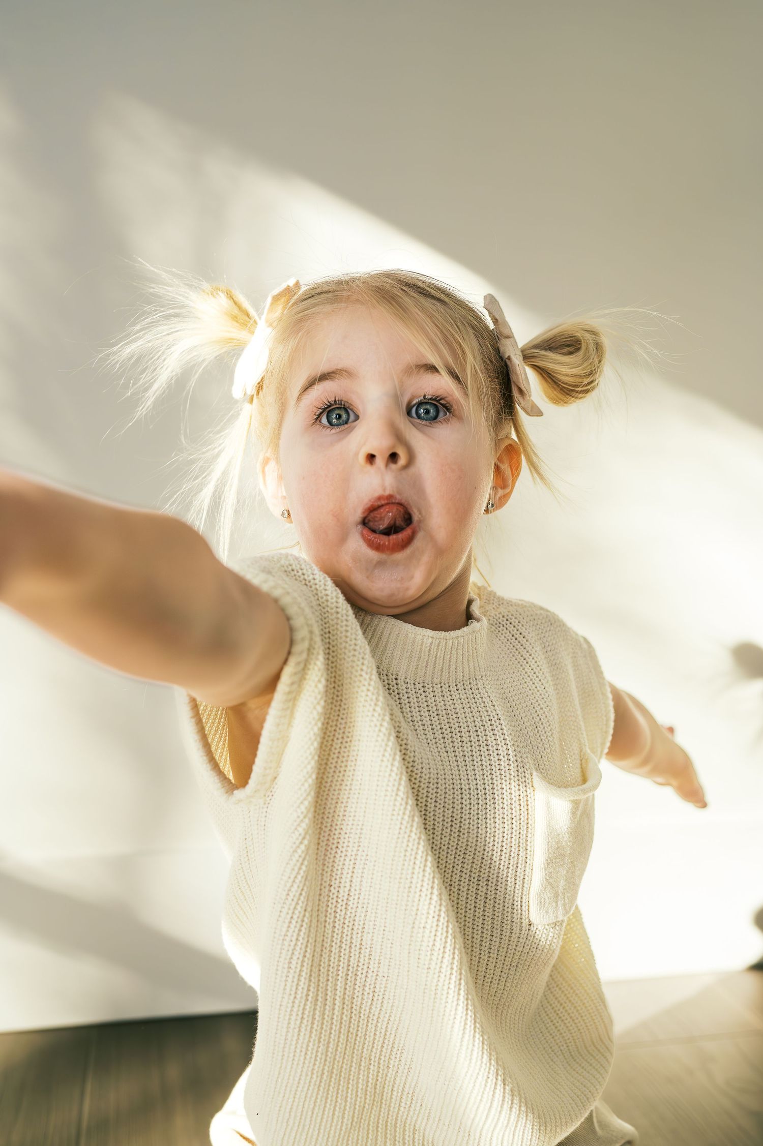 Dynamic movement captured in bright white clothing against neutral background.