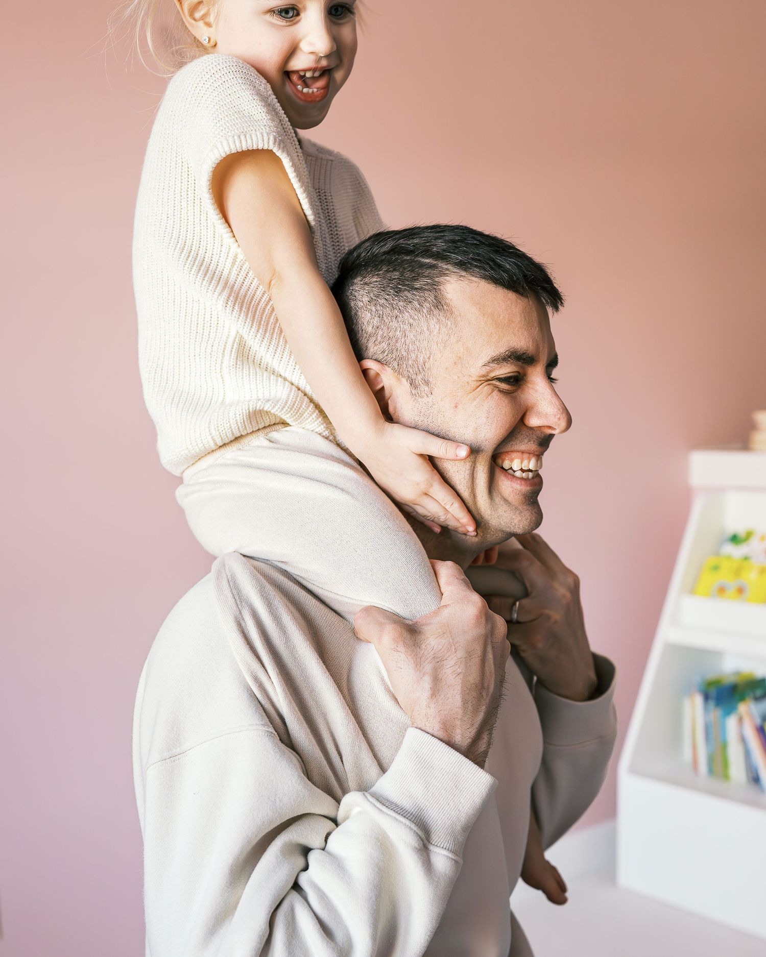 Joyful candid lifestyle moments captured in warm tones against a pink background.