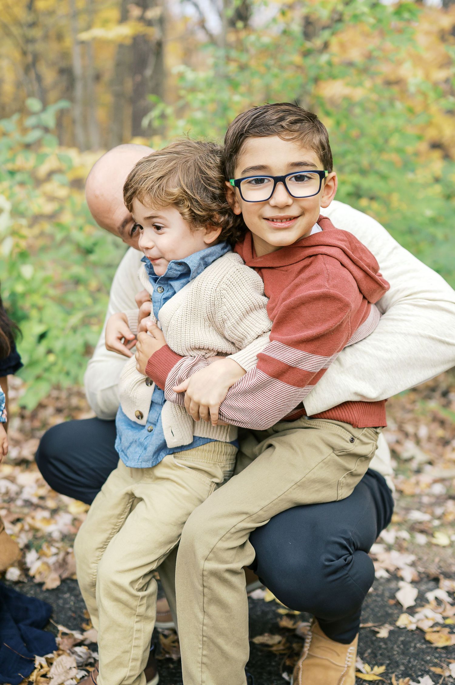 Candid shots of family members embracing and laughing together outdoors.