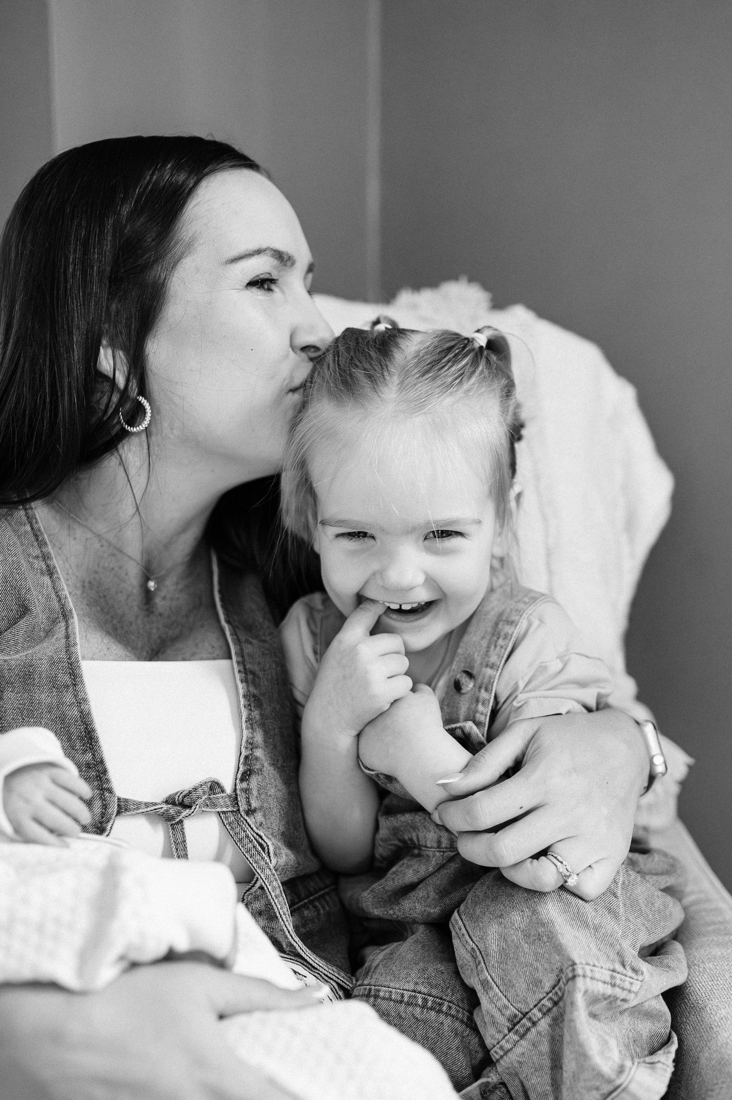 A heartwarming black and white portrait capturing a tender family moment.