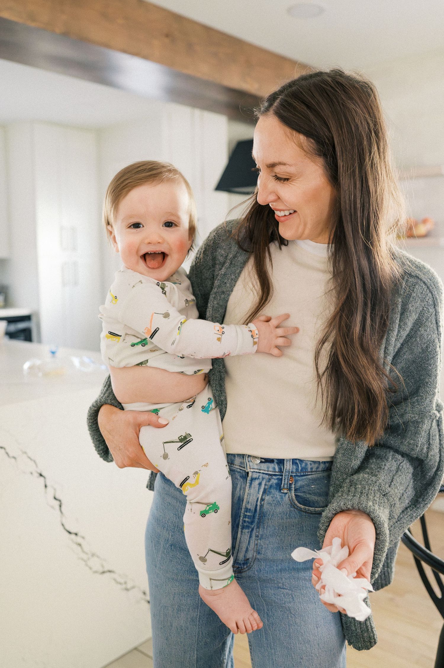Candid moments of family bonding in a bright, modern kitchen setting.
