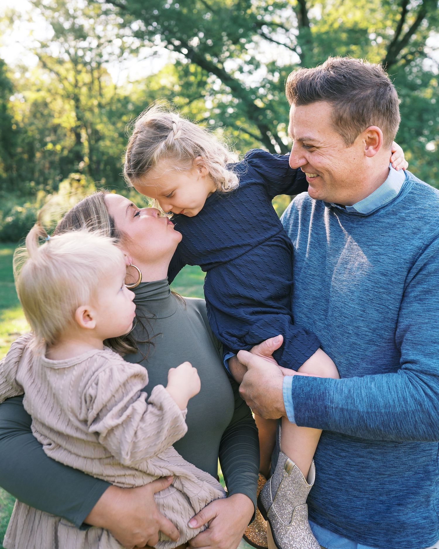A series of candid outdoor family photos showing playful interactions in a park with autumn trees in the background.