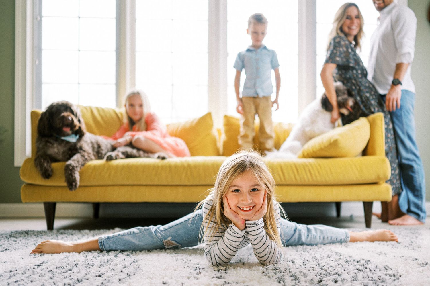 Candid shots of family bonding time in a modern living room with natural lighting.