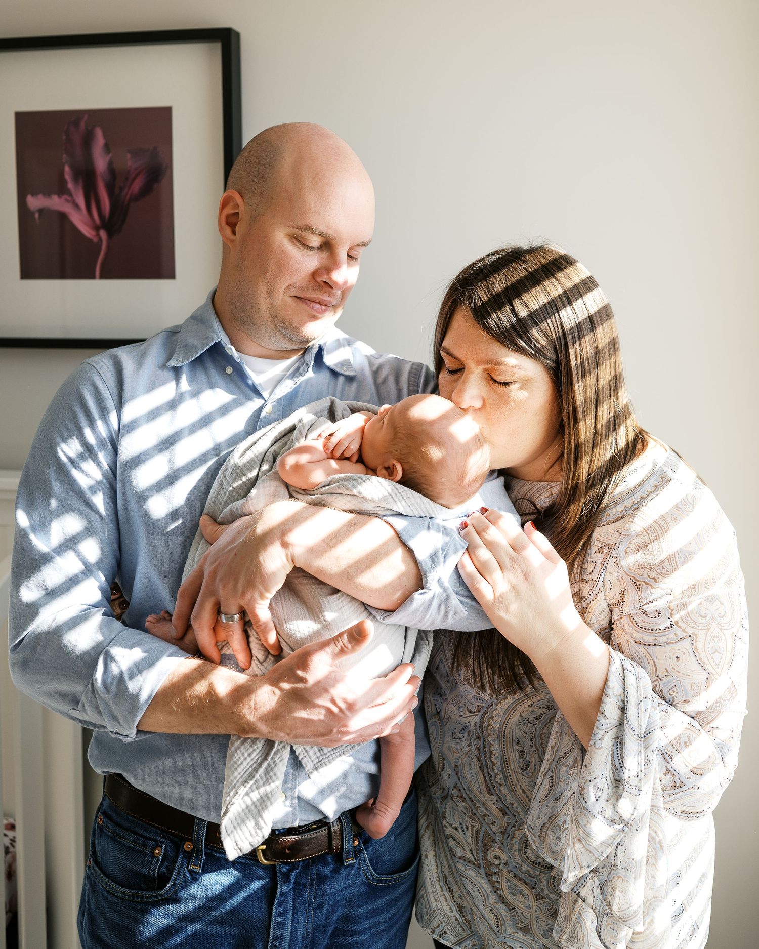 Family portrait series showing parents sharing loving moments with their newborn baby.