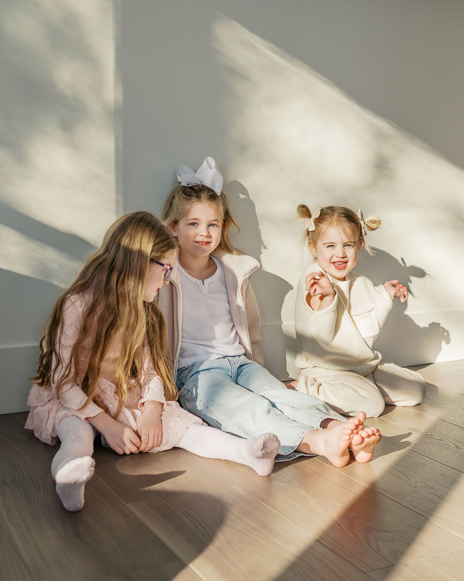 Natural light streaming through windows onto floor with soft shadows.