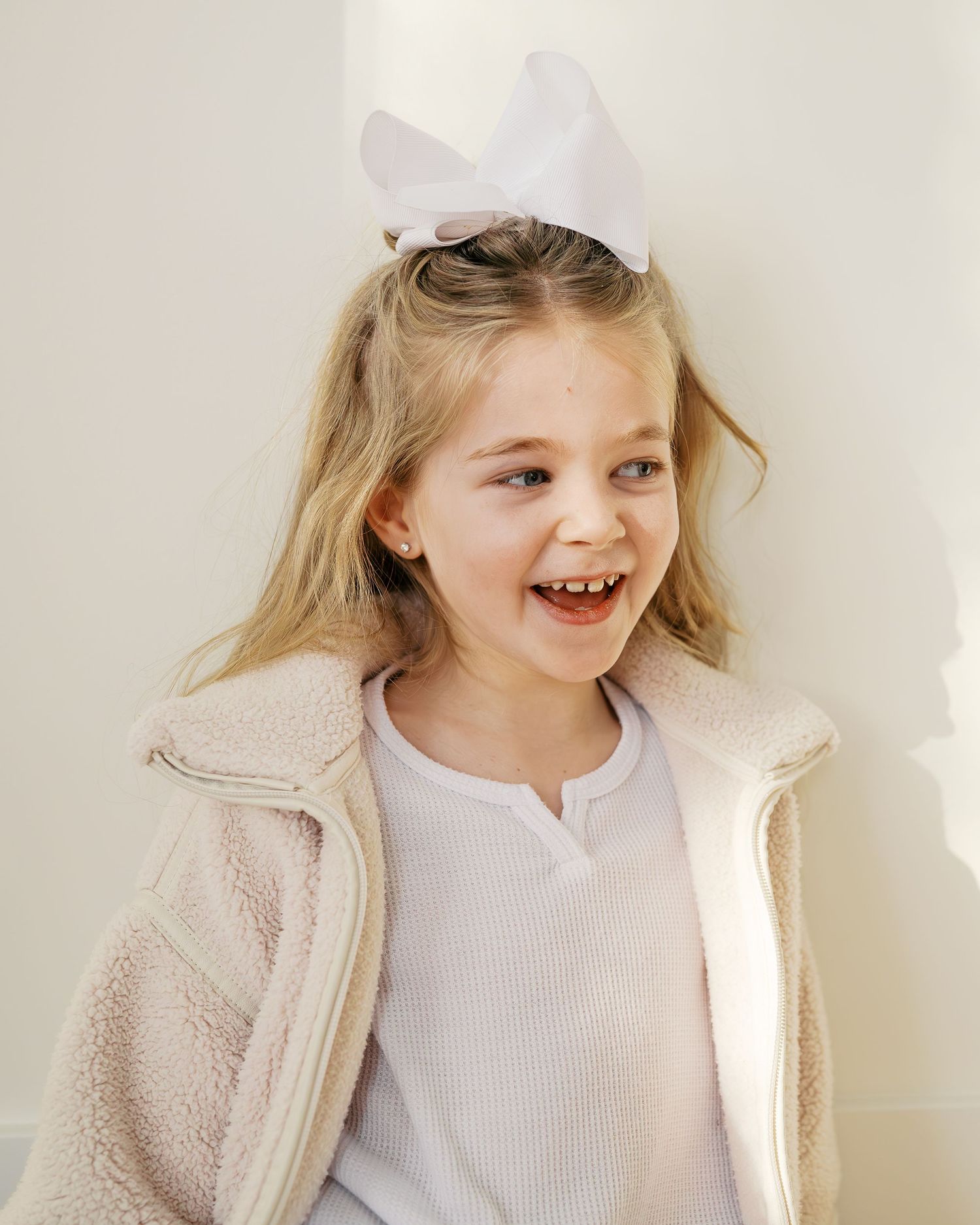 Light and airy portraits showcasing genuine expressions and soft textures.