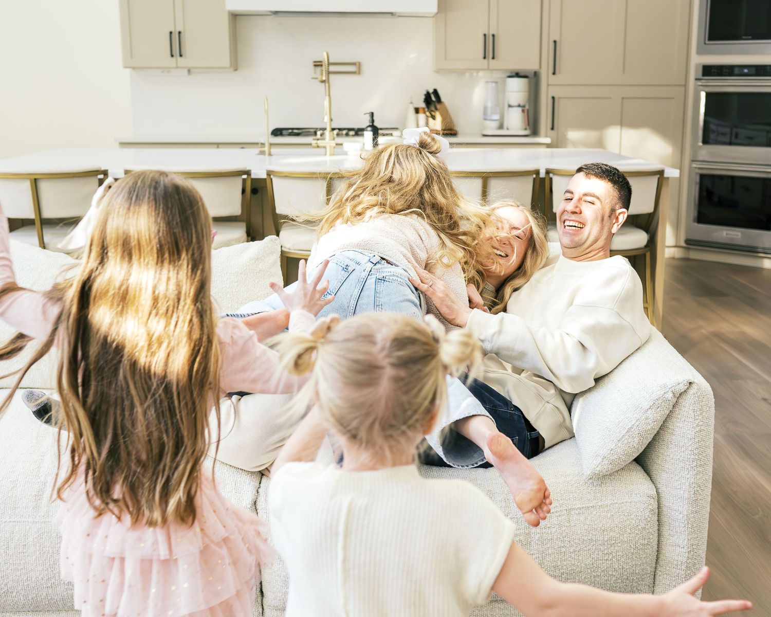 Joyful moments shared between family members in a bright home interior.