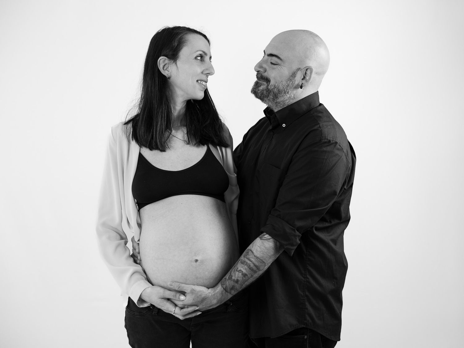 Black and white intimate couple portraits against white background.