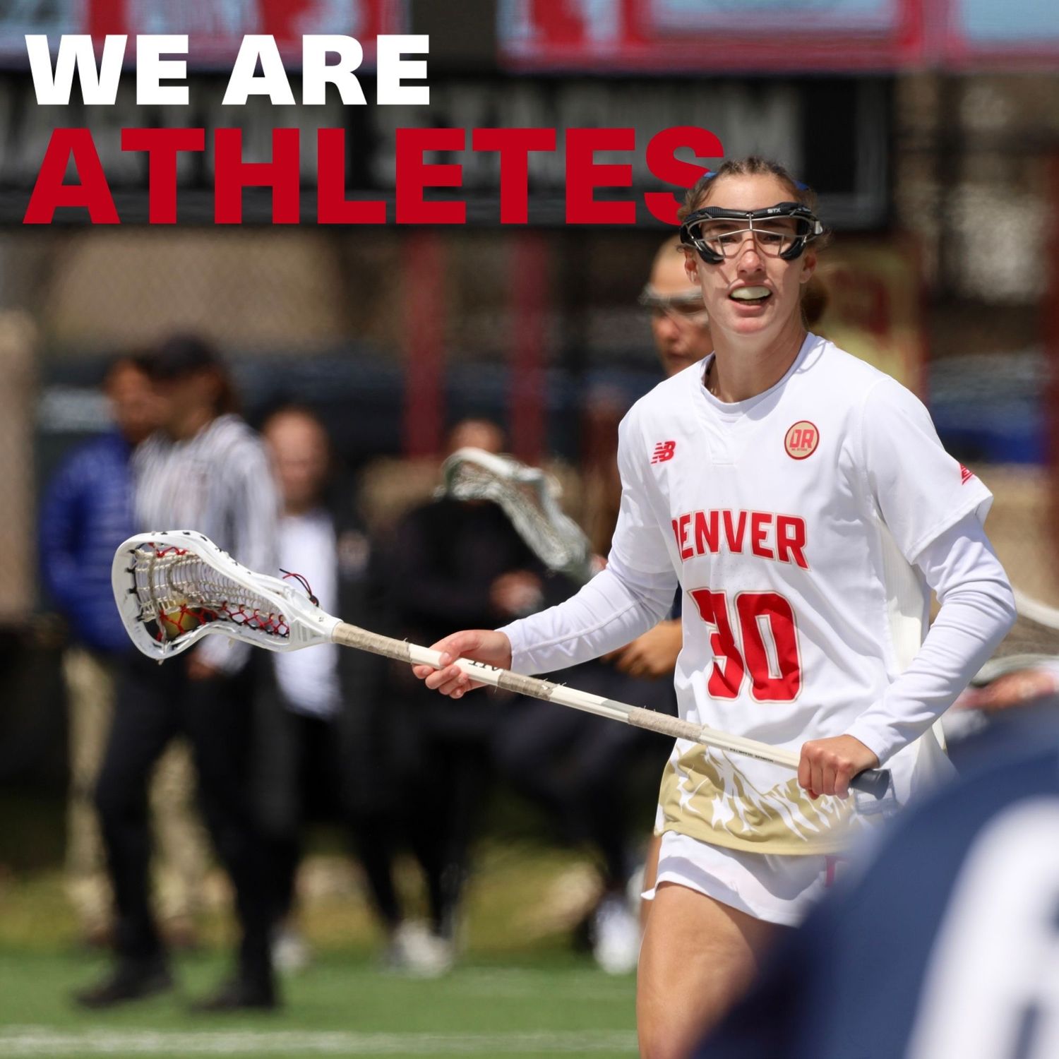 Denver lacrosse player #30 in white uniform runs on field, text reads We Are Athletes.