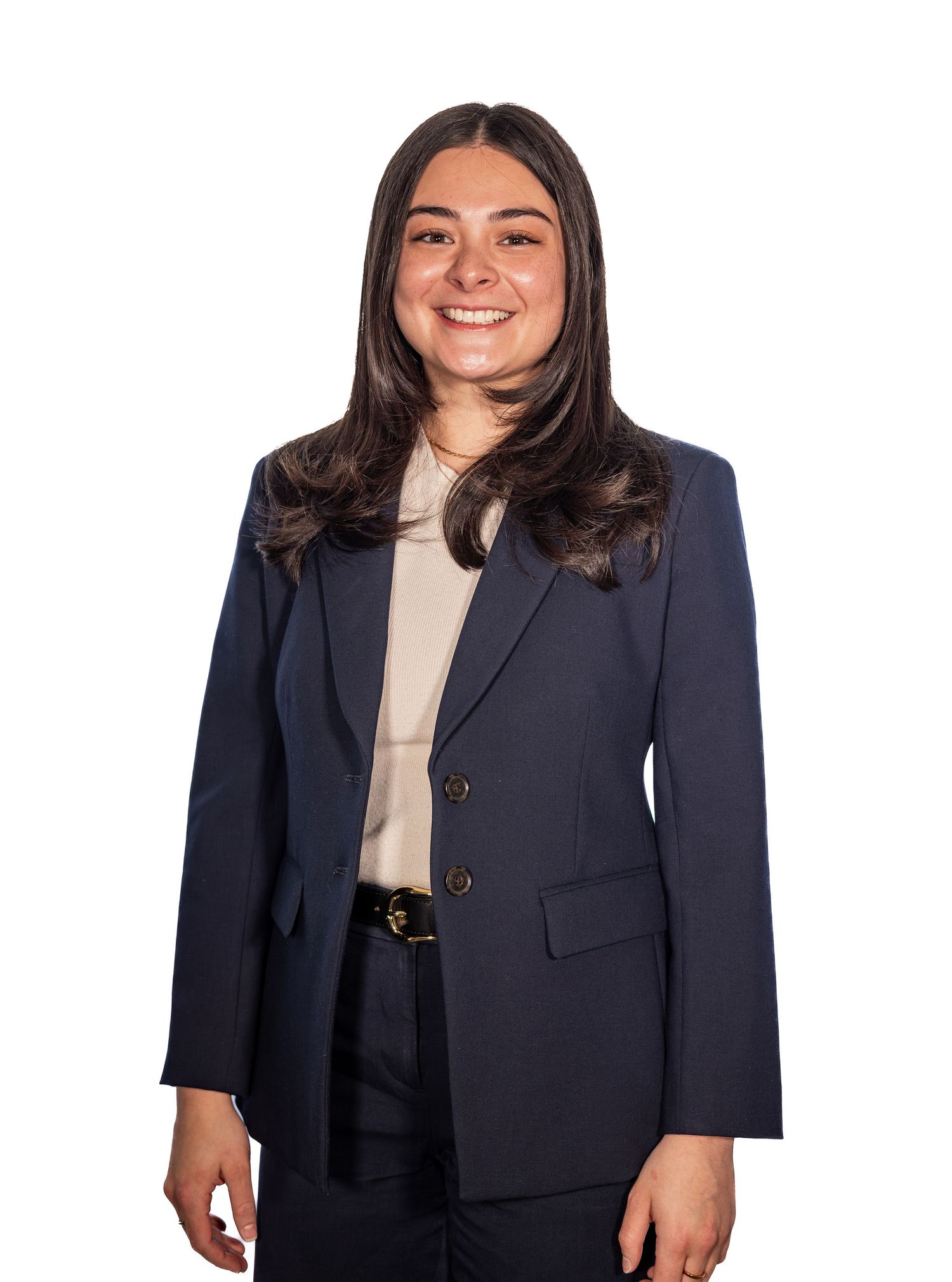 Young professional woman smiling in navy blazer and beige top, formal business portrait on white background.