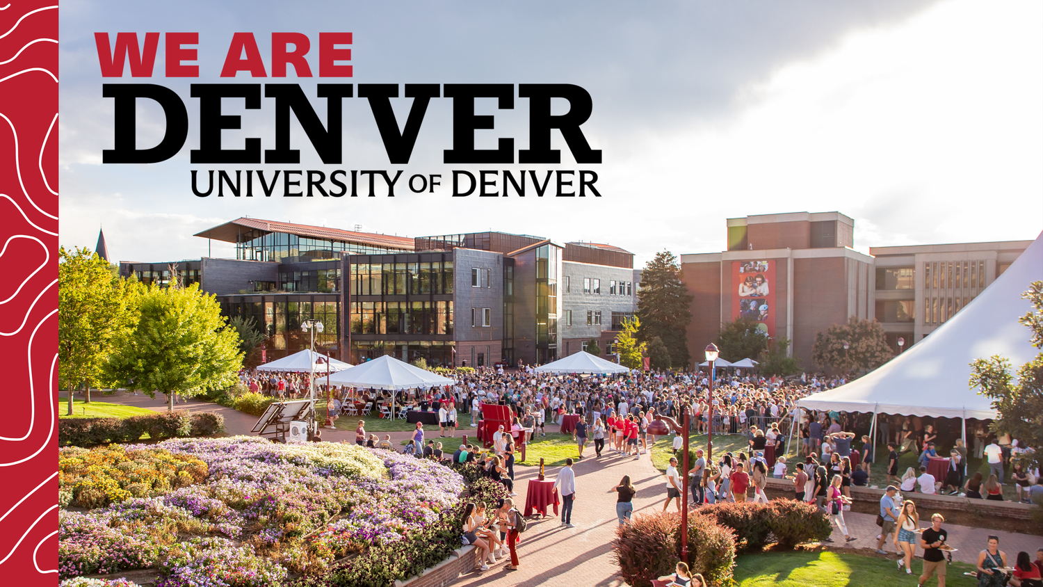 University of Denver campus with students gathering at an outdoor event near landscaped gardens and academic buildings.