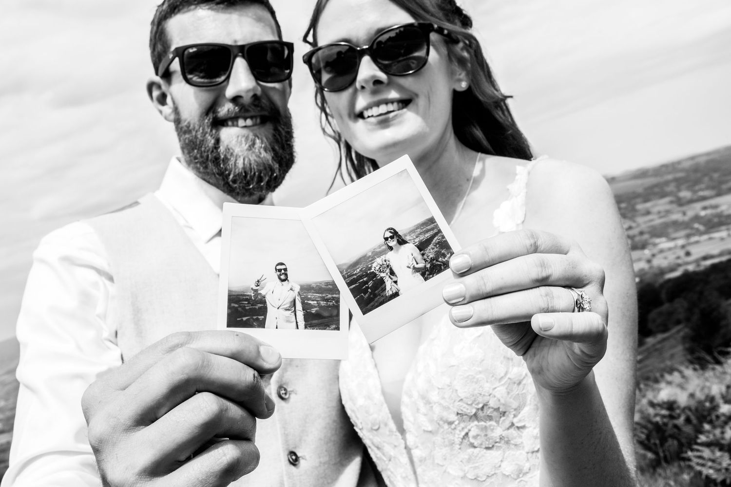 Couple in sunglasses sharing intimate moments outdoors during their wedding celebration.
