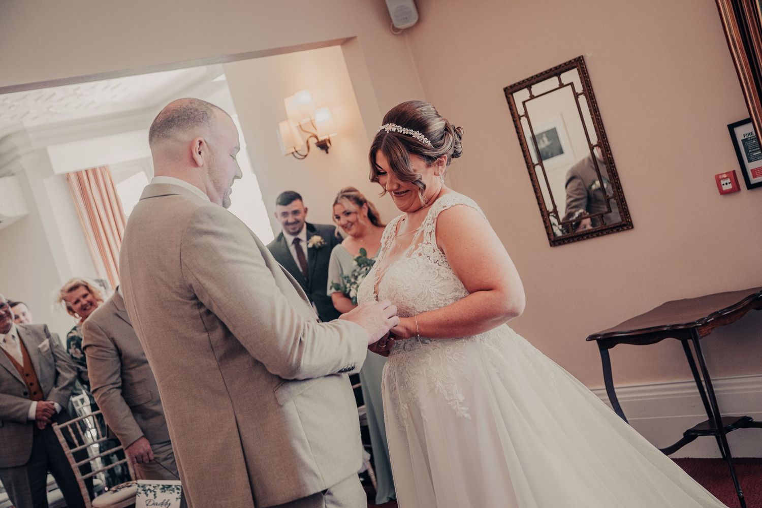 Indoor wedding venue scenes with warm lighting and traditional decor.