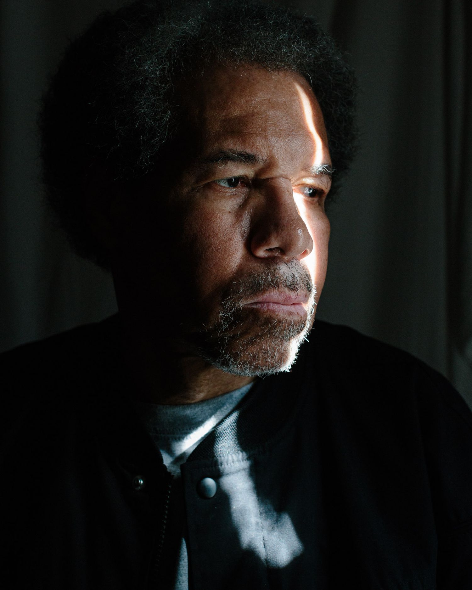 A dramatic side-lit portrait series showing different angles of a person in low-key lighting against a dark background.