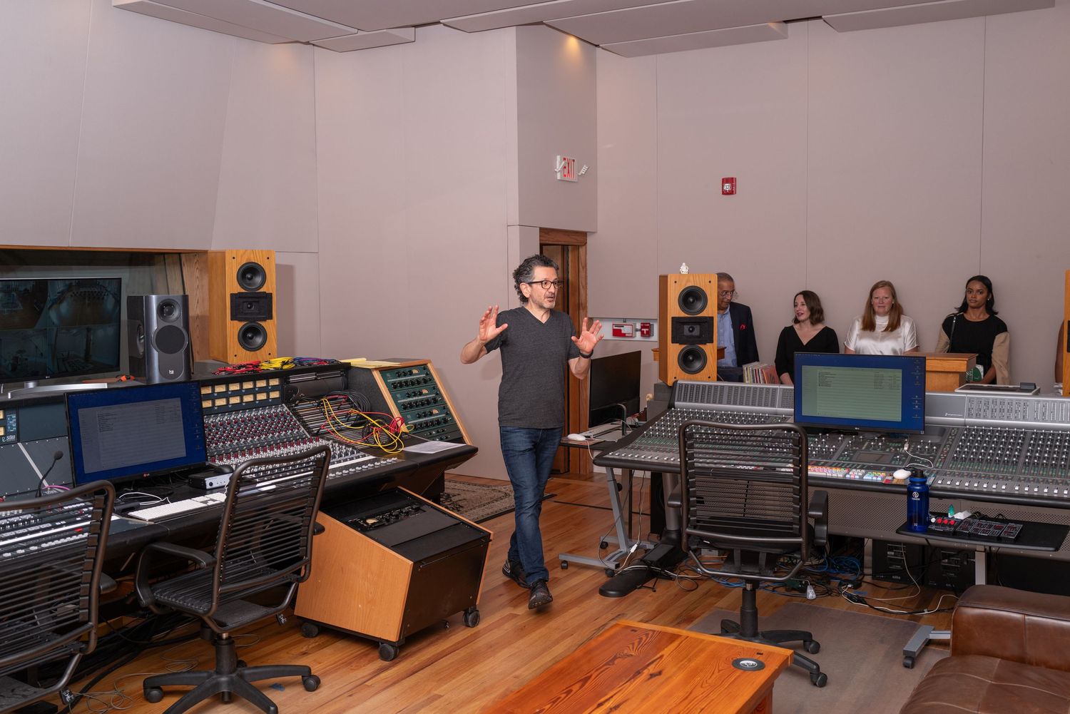 Professional recording studio control room with mixing consoles and audio equipment.
