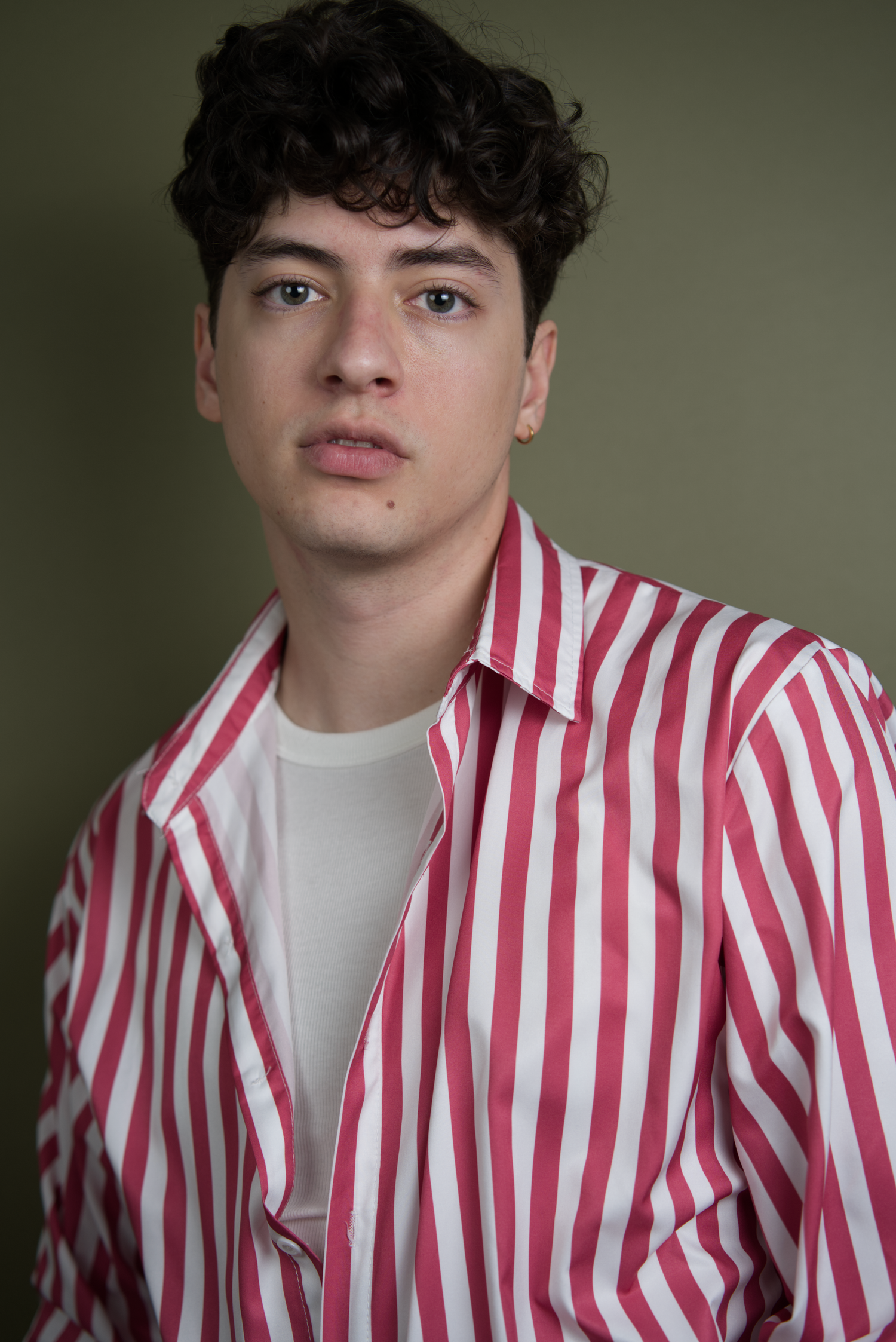 A series of photos showing someone in a red and white striped shirt against a neutral background.